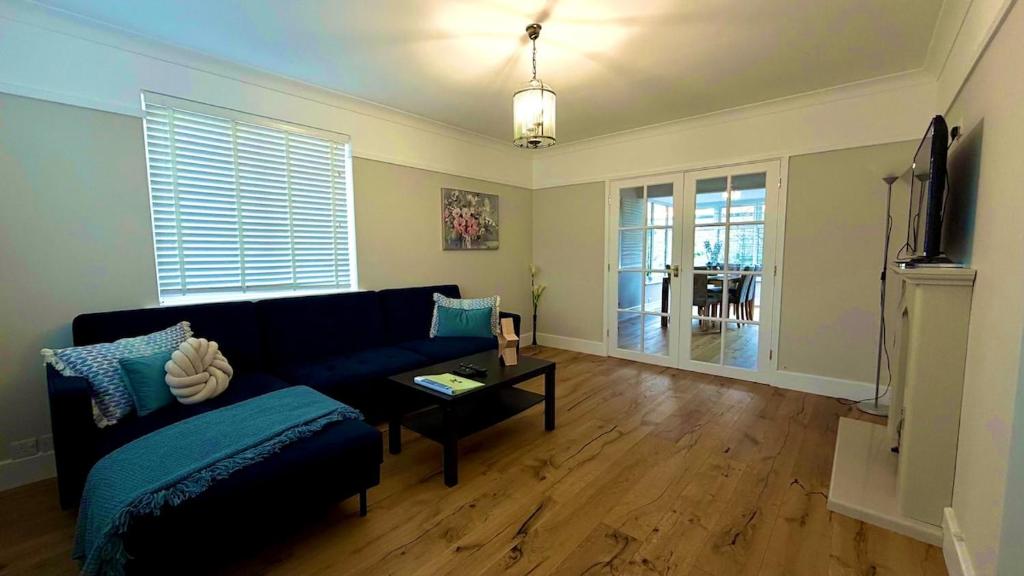 a living room with a couch and a tv at Aughamore Home in CBG