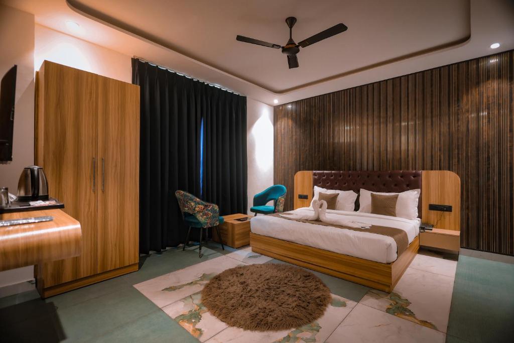 Giường trong phòng chung tại Troy Resorts and wellness