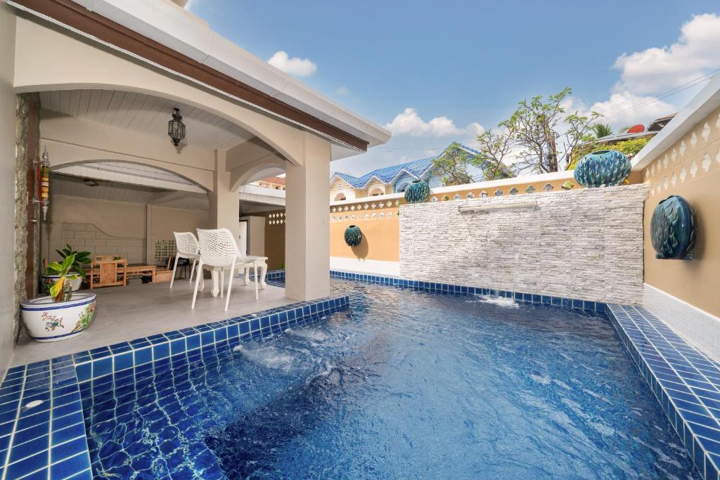 een zwembad in de achtertuin van een huis bij Bangla Patong Pool Villas with 4 Villas different designs choose fro, photo before Book in Patong Beach