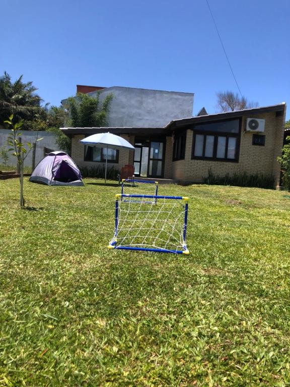 a golf cart in a yard in front of a house at Casa rústica in Torres