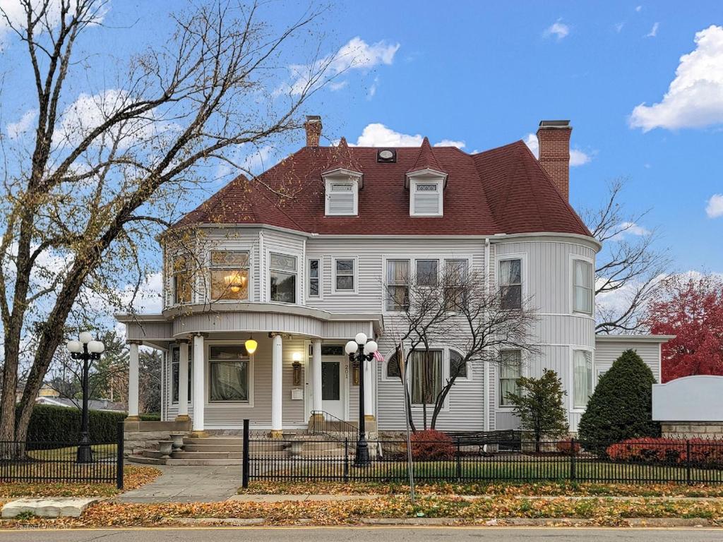 a large white house with a red roof at The Palace in Rockford