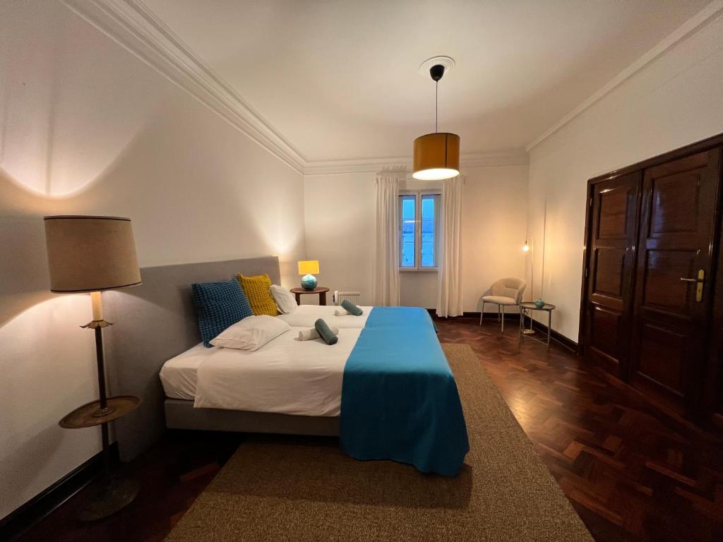 En eller flere senge i et værelse på Portas Residence, Quartos & Suites - Ponta Delgada City Center