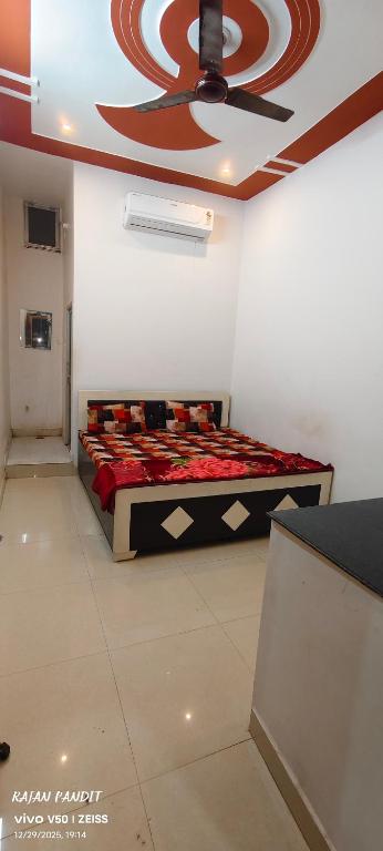 a bedroom with a large bed in a room at Sita pathik niwas in Jāmb