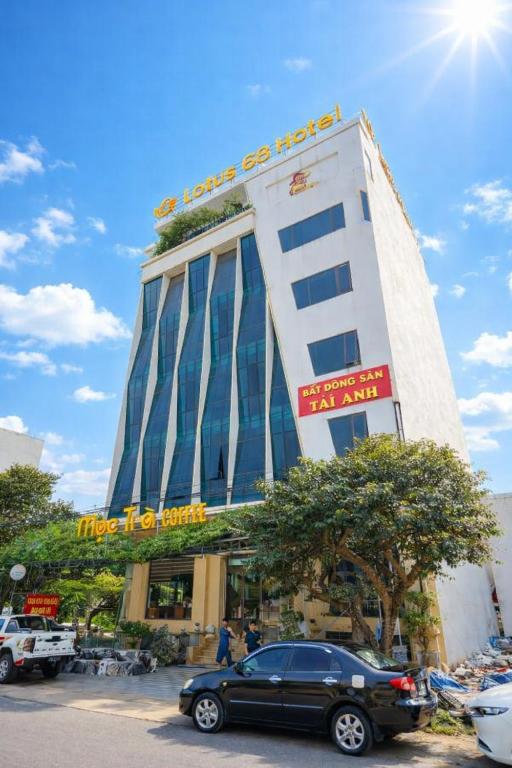 a building with a car parked in front of it at Lotus 68 Hotel in Ninh Binh