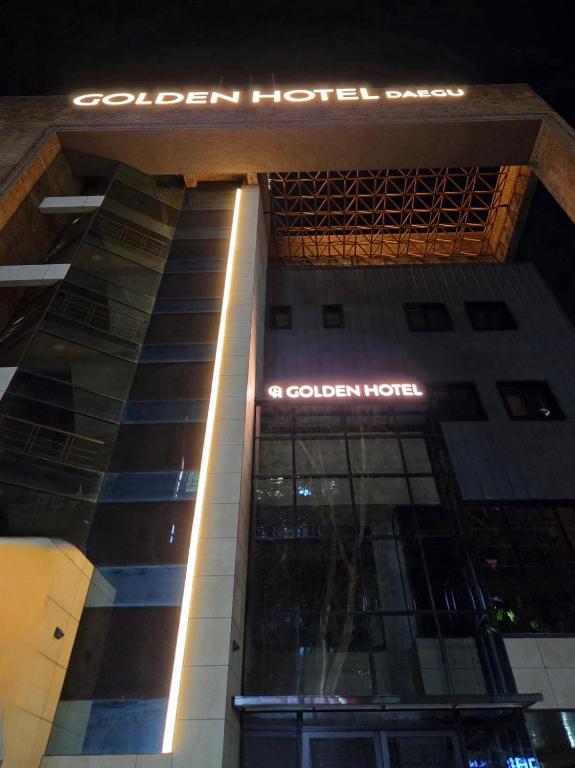a building with a sign that reads golden hotel at Golden Hotel 골든 호텔 in Hyomoktong-Ilgu
