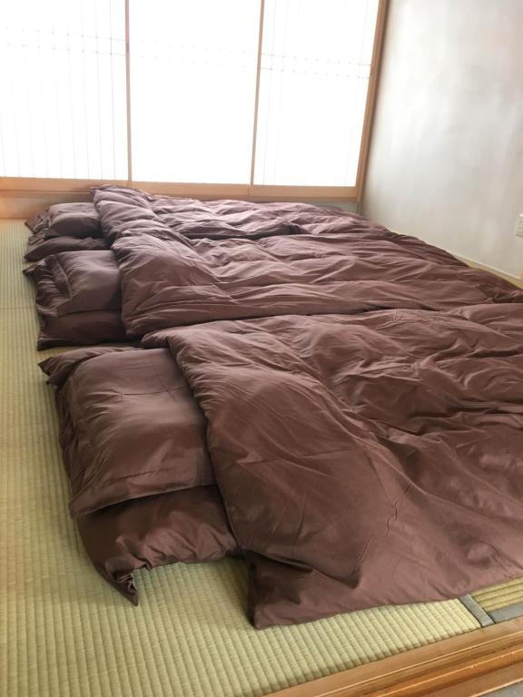 Letto o letti in una camera di Nara Guesthouse Kamunabi