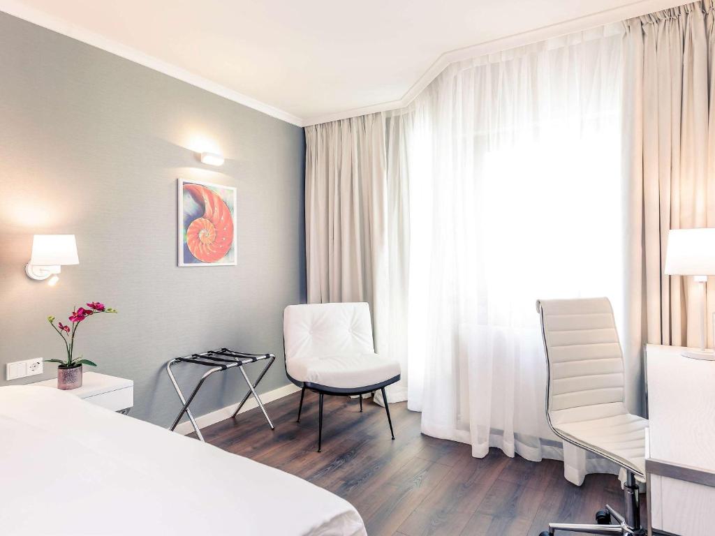 Postel nebo postele na pokoji v ubytování Mercure Hotel Raphael Wien
