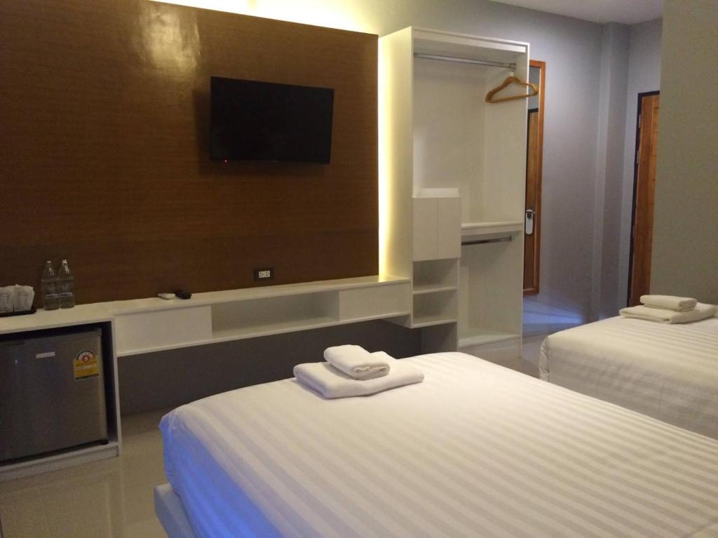 Postel nebo postele na pokoji v ubytování Le Terrarium Bed & Sleep Chiang Rai