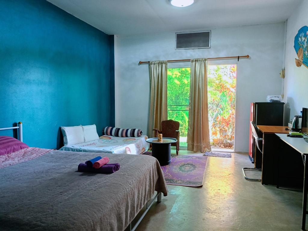 En eller flere senge i et værelse på Six Nature Resort