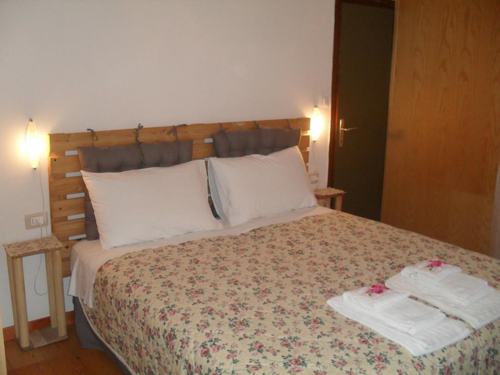 Postel nebo postele na pokoji v ubytování Casa Noemi Imer