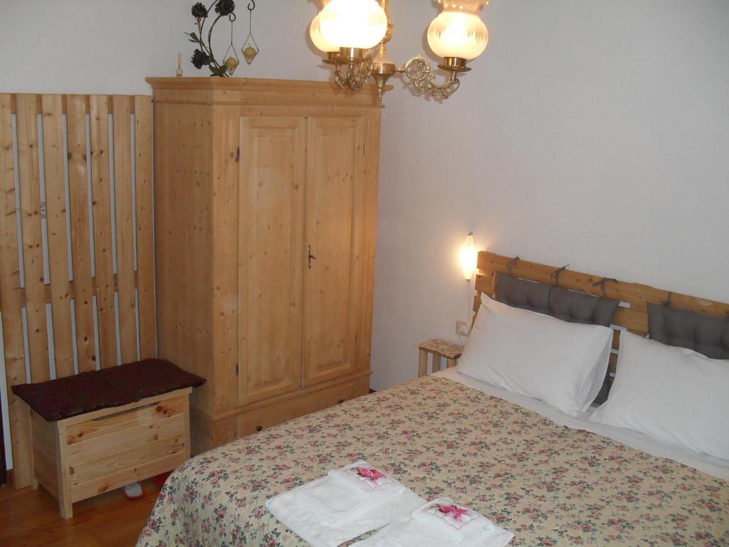 Postel nebo postele na pokoji v ubytování Casa Noemi Imer