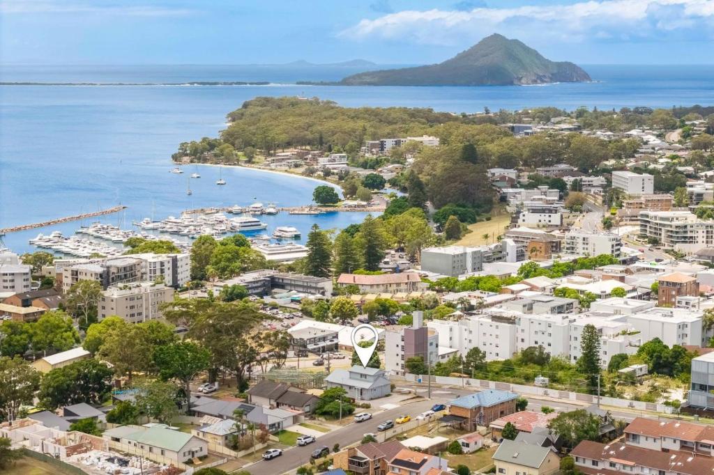 an aerial view of a city and a harbor at Dalton Escape in Nelson Bay