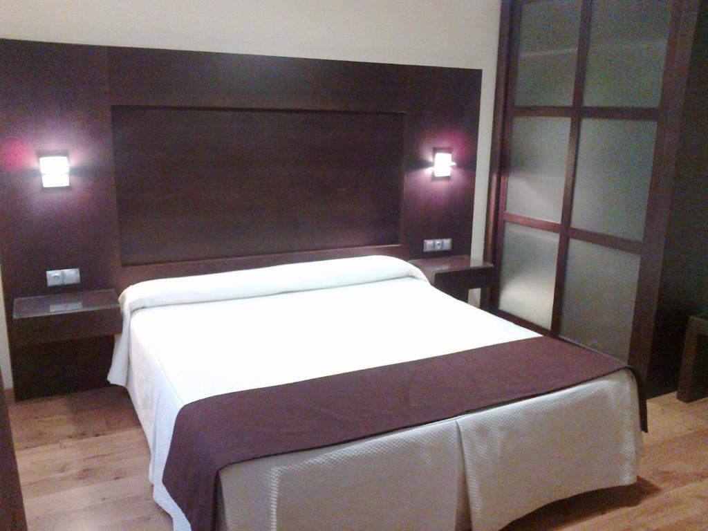 Postel nebo postele na pokoji v ubytování Hotel Anabel Baza