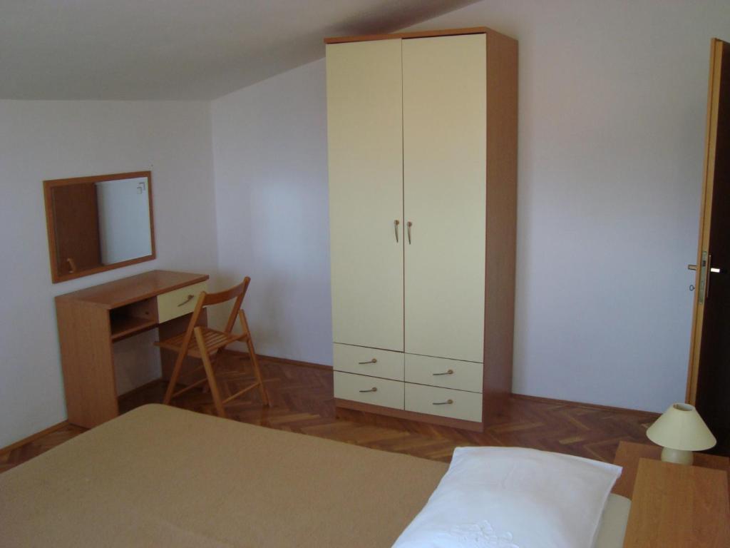 Postel nebo postele na pokoji v ubytování Apartmani Ždrelac