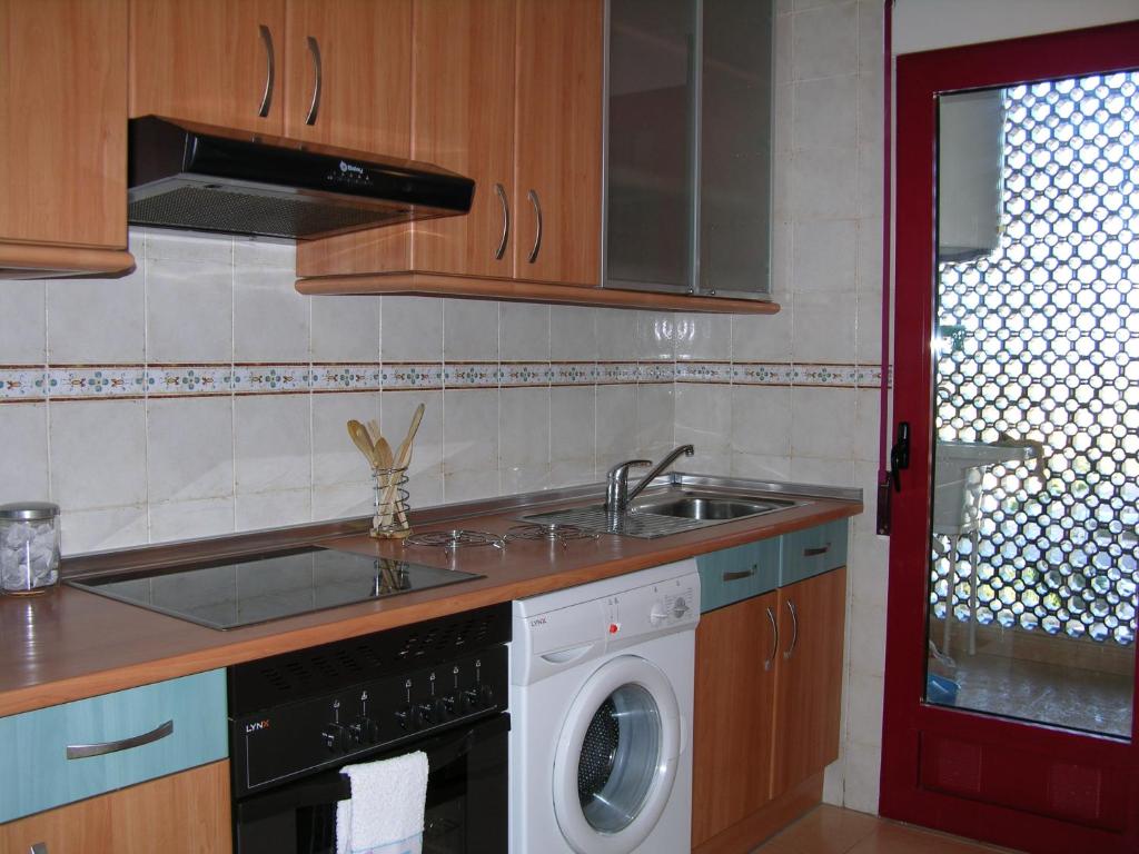A kitchen or kitchenette at Verdemar 8907 - Resort Choice
