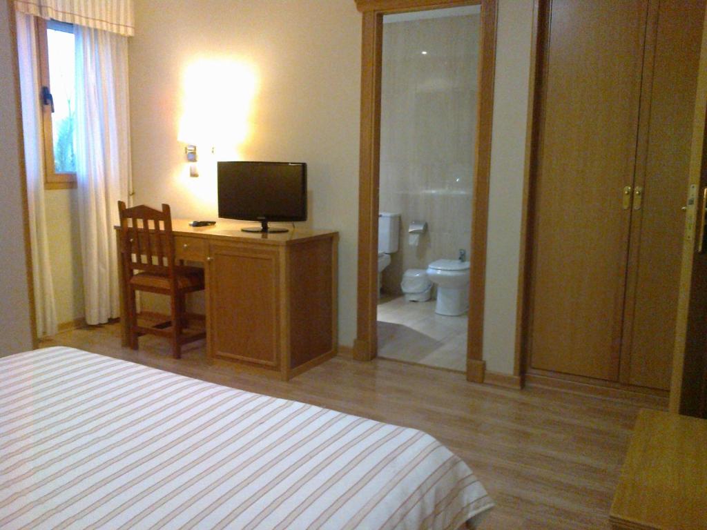 Postel nebo postele na pokoji v ubytování Hotel Anabel Baza