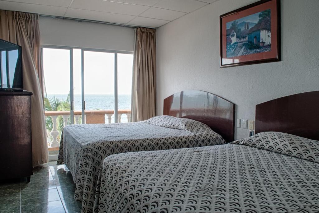 Postel nebo postele na pokoji v ubytování Hotel Real del Mar