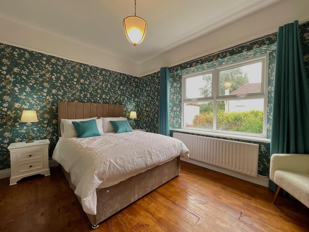 a bedroom with a bed and a window at Apartment in Omagh in Omagh