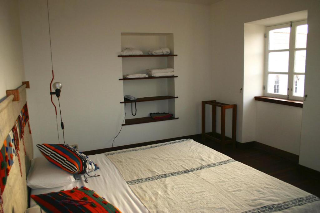Postel nebo postele na pokoji v ubytování Casa Café Mindelo