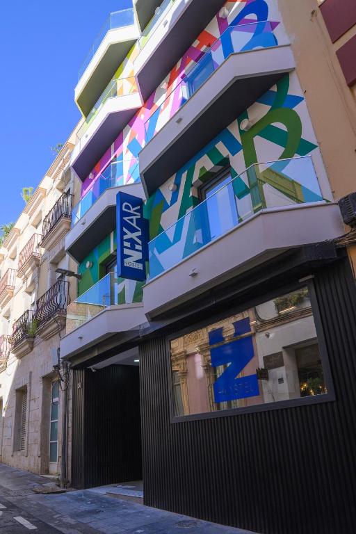 a building with a mural on the side of it at Hostel Nixar in Almería