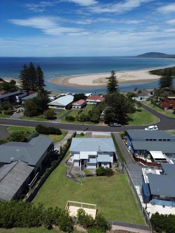 an aerial view of a small town next to a beach at Beside the Seaside Gerroa Dual Family Living in Gerroa