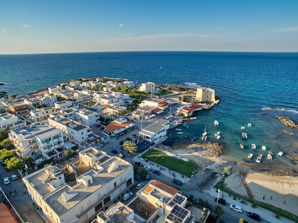 an aerial view of a town on the ocean at Hotel Cicò in Torre Santa Sabina