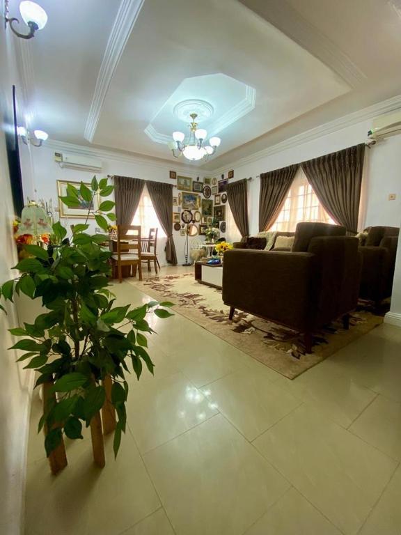 a living room with a couch and a table at Suitehub in Ikeja