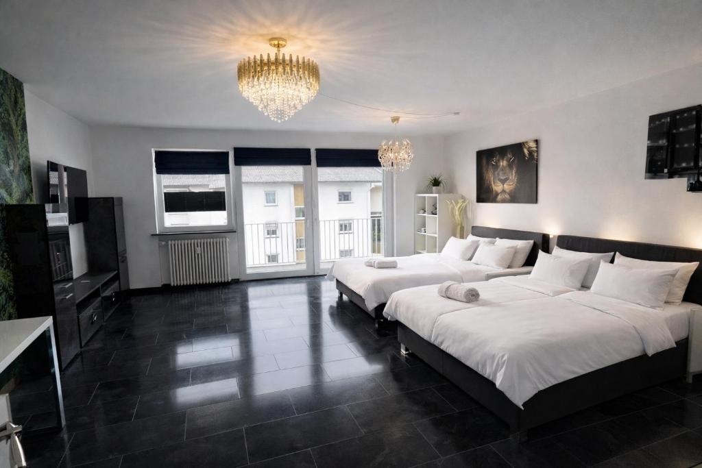 Postel nebo postele na pokoji v ubytování Exklusive Moderne Wohnung Gießen Stadtnähe mit Balkon