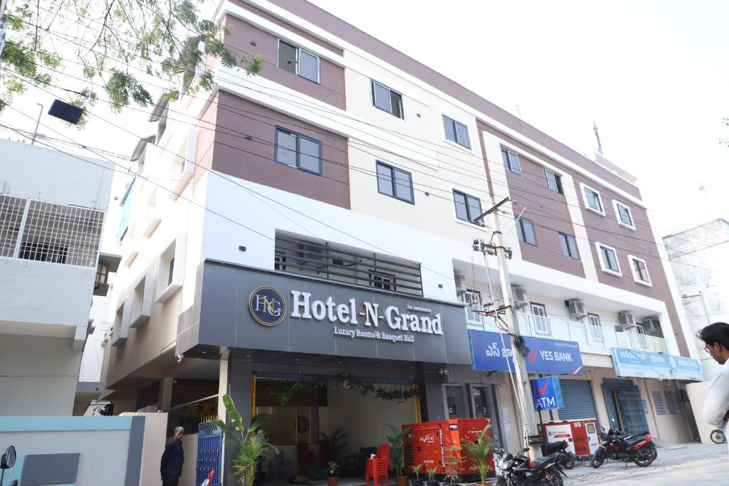 a building with a hotel ne grand on the street at Hotel N Grand in Miriālgūda