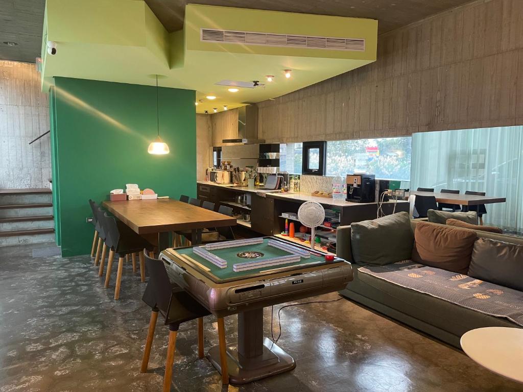 a room with a ping pong table and a ping pong table at Turn Back the clock Homestay in Dongshan