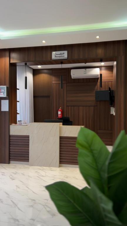 a waiting room with a counter in a hospital at متسع للشقق المخدومة - اقتصادي in Hail