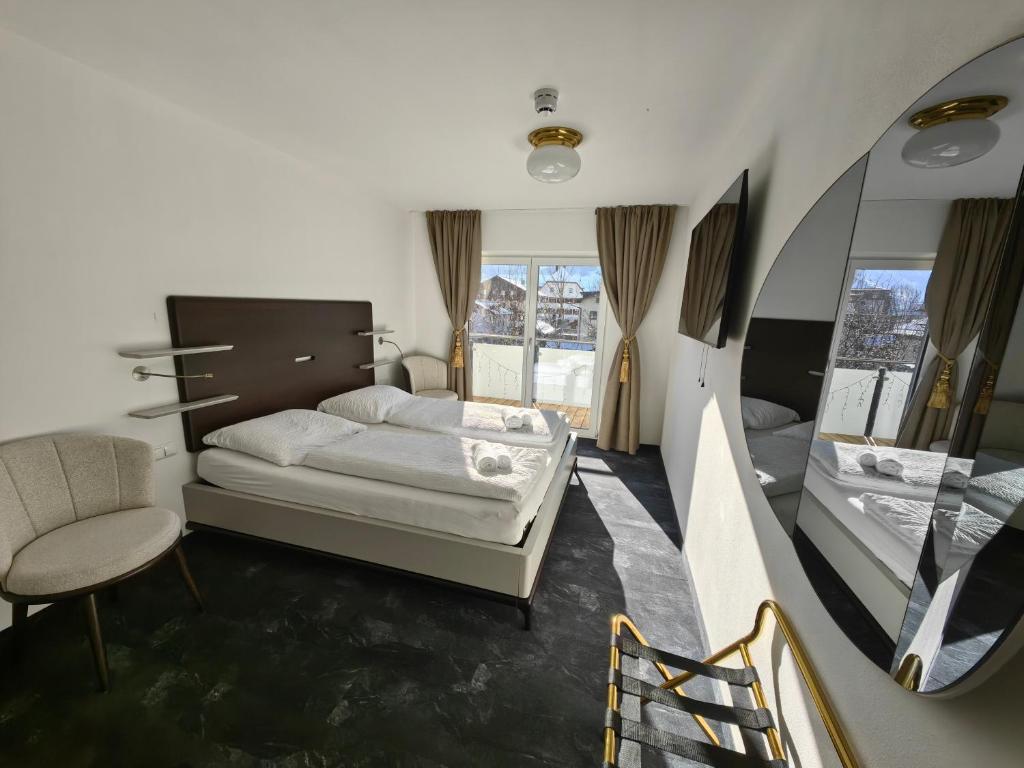 En eller flere senge i et værelse på Thurners Boutique Hotel