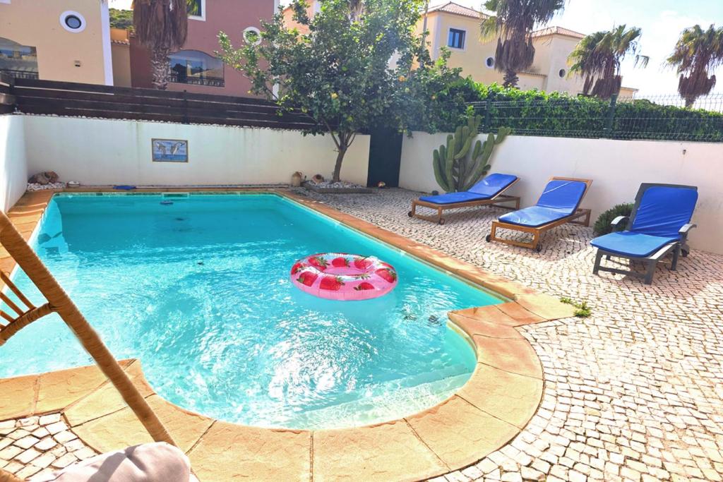 a swimming pool with a frisbee in the water at SV Villa Burgau in Burgau