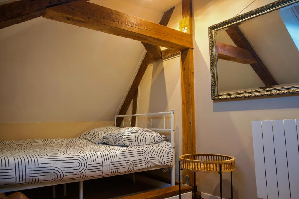 Giường trong phòng chung tại L'Orée d'Etretat