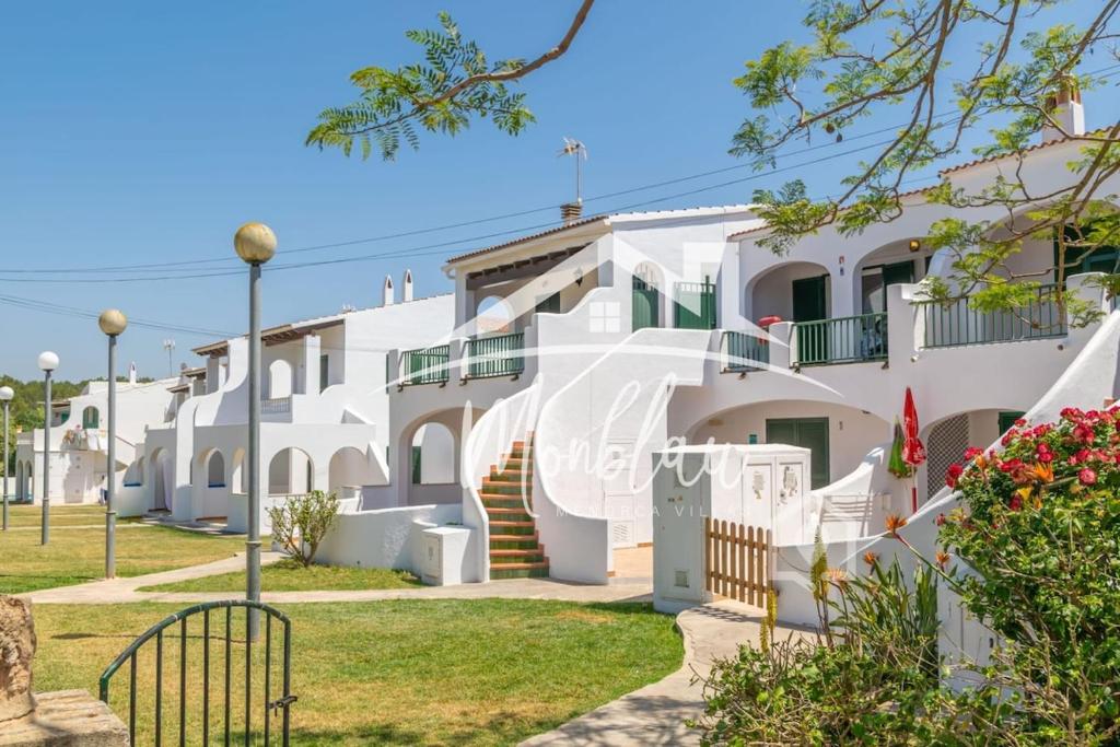 a row of white apartment buildings with stairs at Saray Son Alma in Son Carrio