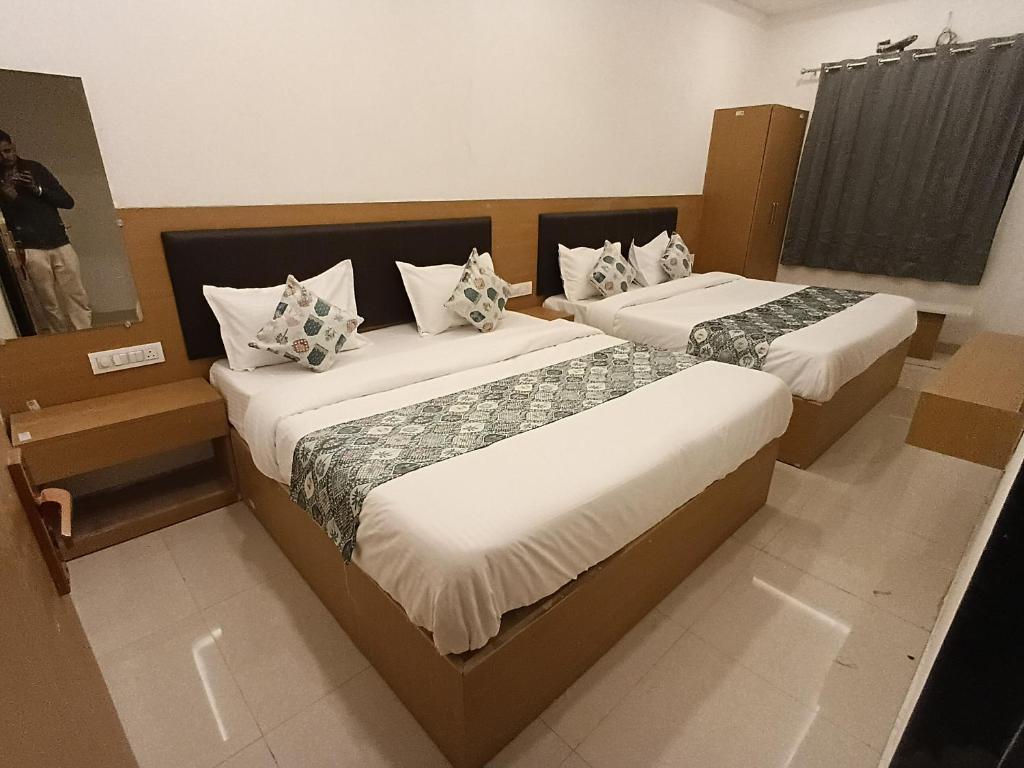 Giường trong phòng chung tại HOTEL JMM inn