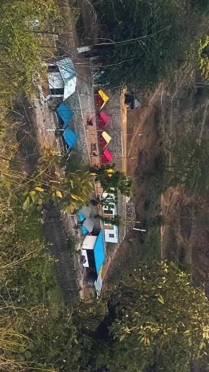 an aerial view of cars parked on a road at Kinara Camping in Kailāna