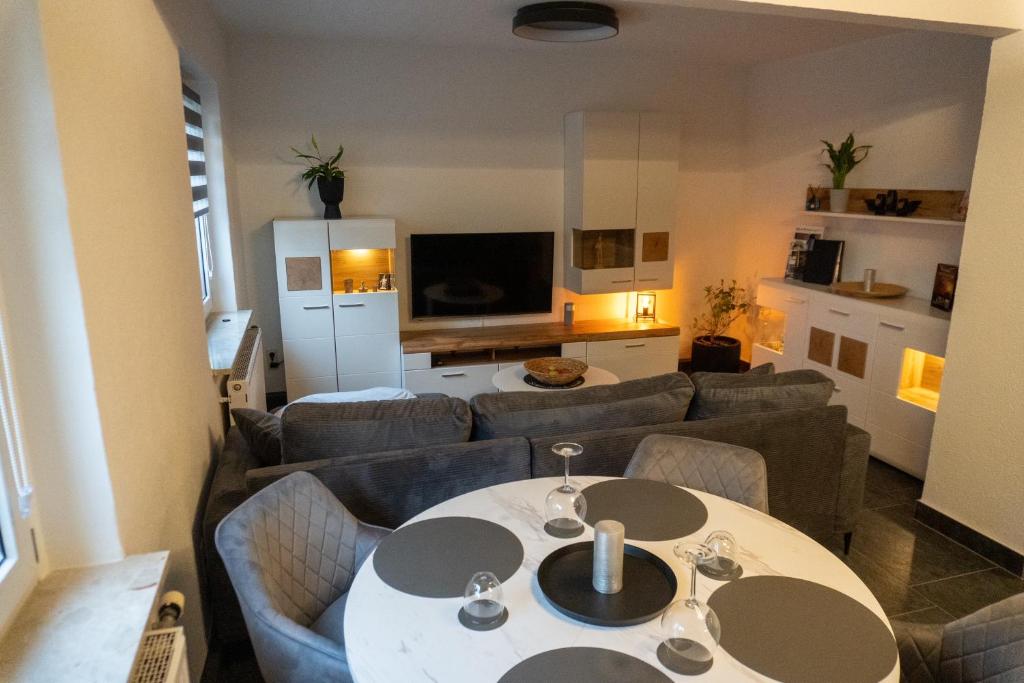a living room with a couch and a table at Ferienwohnung Gleesbergquelle in Aue-Bad Schlema