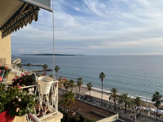 a view of the ocean from a balcony of a building at Rocamare, la Vie est Belle! in Cannes