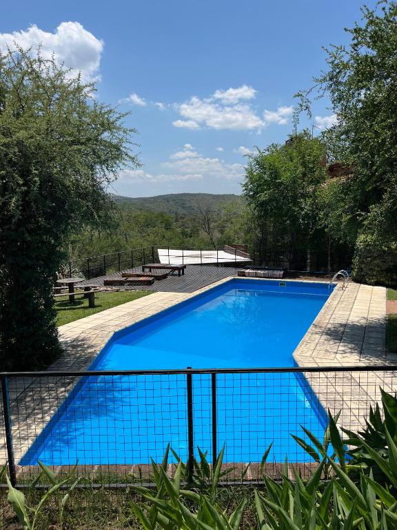 a swimming pool with a view of the mountains at Los Cardones de Mayu in San Antonio de Arredondo