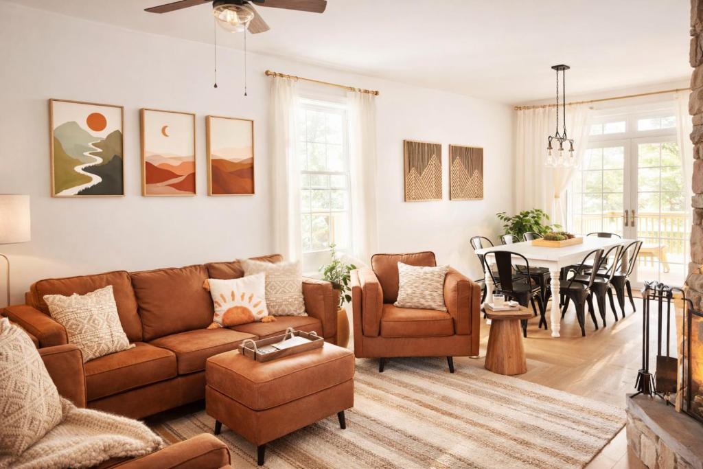 a living room with a couch and a table at Catskill Cabin with Firepit & Indoor Jacuzzi Tub in Catskill