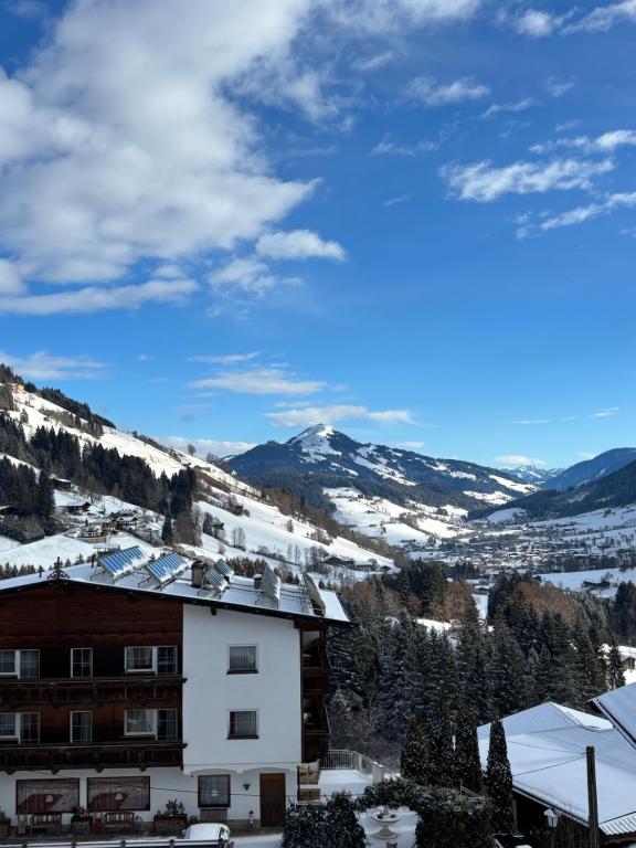 a view of a ski resort with snow covered mountains at Landhaus Sonnenzauber in Oberau