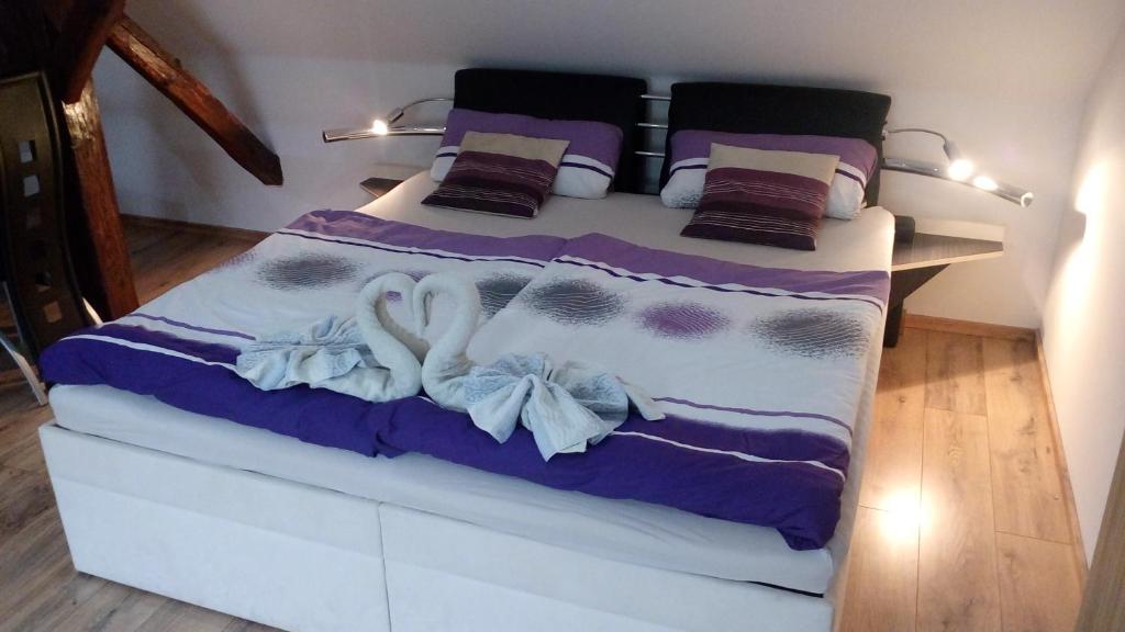 Postel nebo postele na pokoji v ubytování Apartmány Fialka