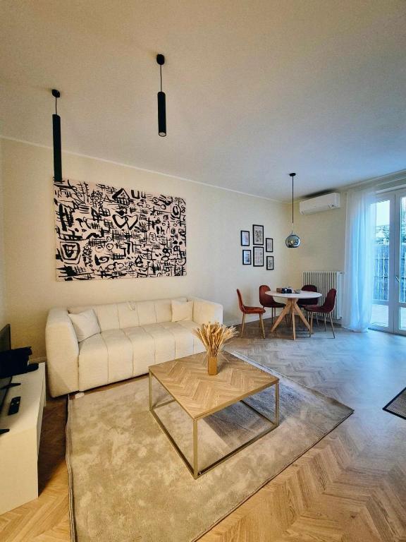 a living room with a couch and a table at Monti26 in Milan