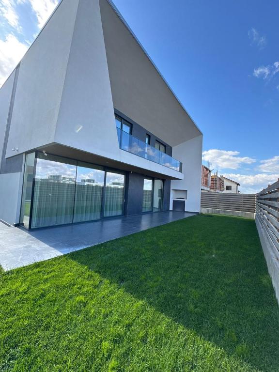 a modern house with a pyramid facade at KNIGHT Villa in Voluntari