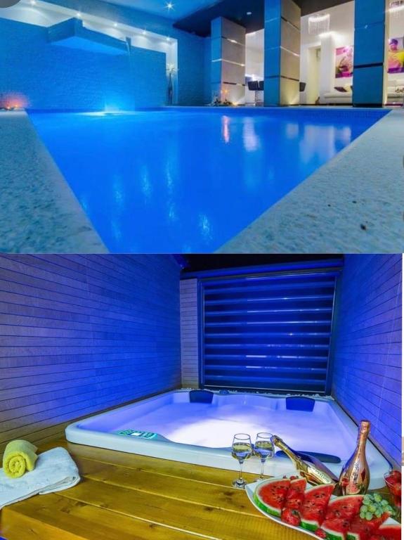 a pool with a tub with a plate of fruit in it at La Vela Luxury in Trogir