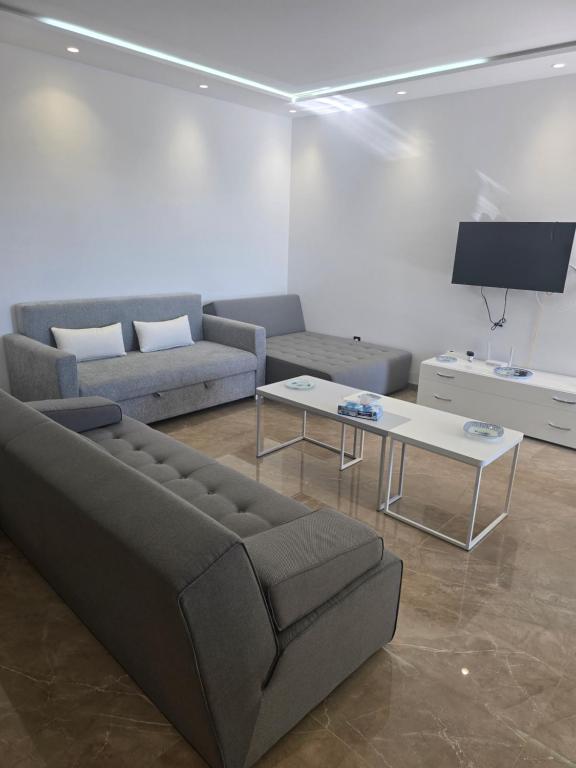 Et tv og/eller underholdning på Luxueux Appartement pieds dans l'eau