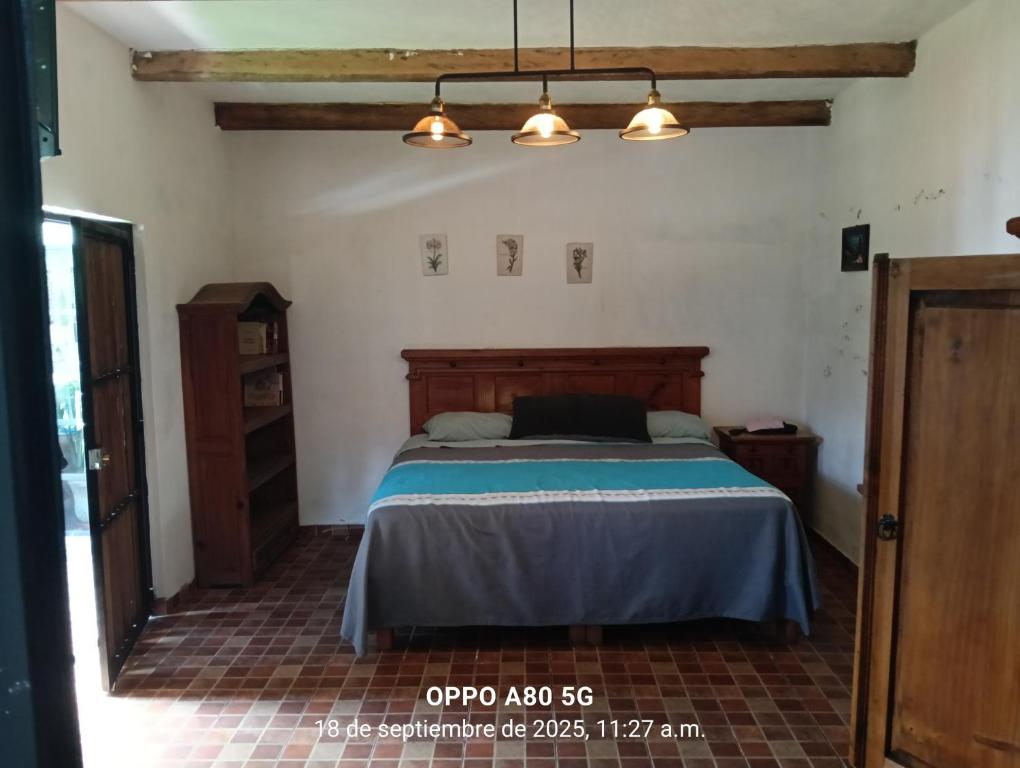 a bedroom with a bed in a room at Casa ixcanul in Montitlán