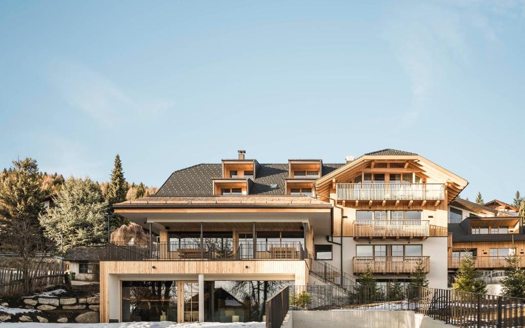 a large house with a lot of windows at Wieserhof Family Farm in Maranza