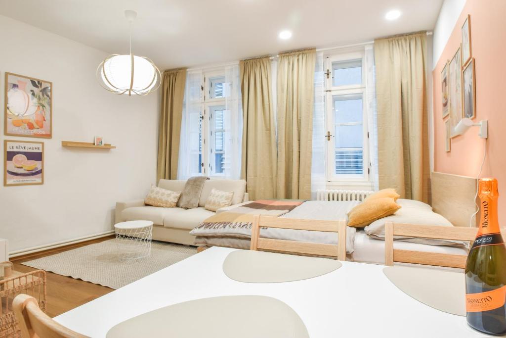 a living room with a couch and a table at Olomouc Central Apartment in Olomouc